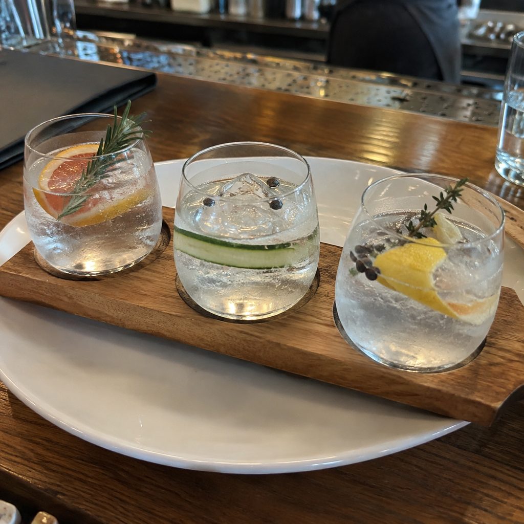 A gin tasting flight on the counter